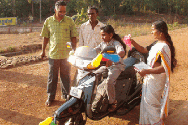 Dr. Majeed Presenting Sindhu A Scooter